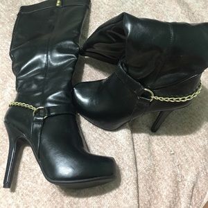 Black knee high pointed toe stiletto boots